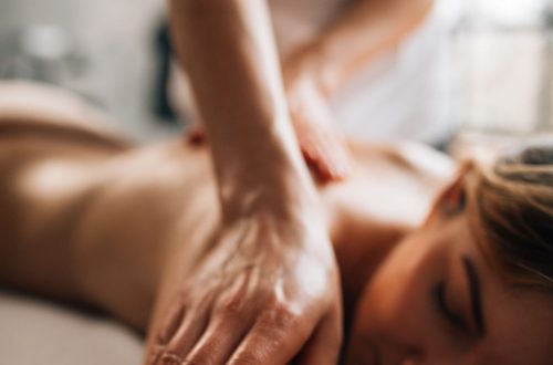Woman being massaged whilst on a table