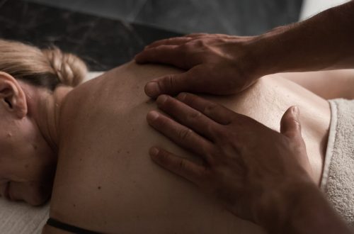 Dark image of someone having a massage